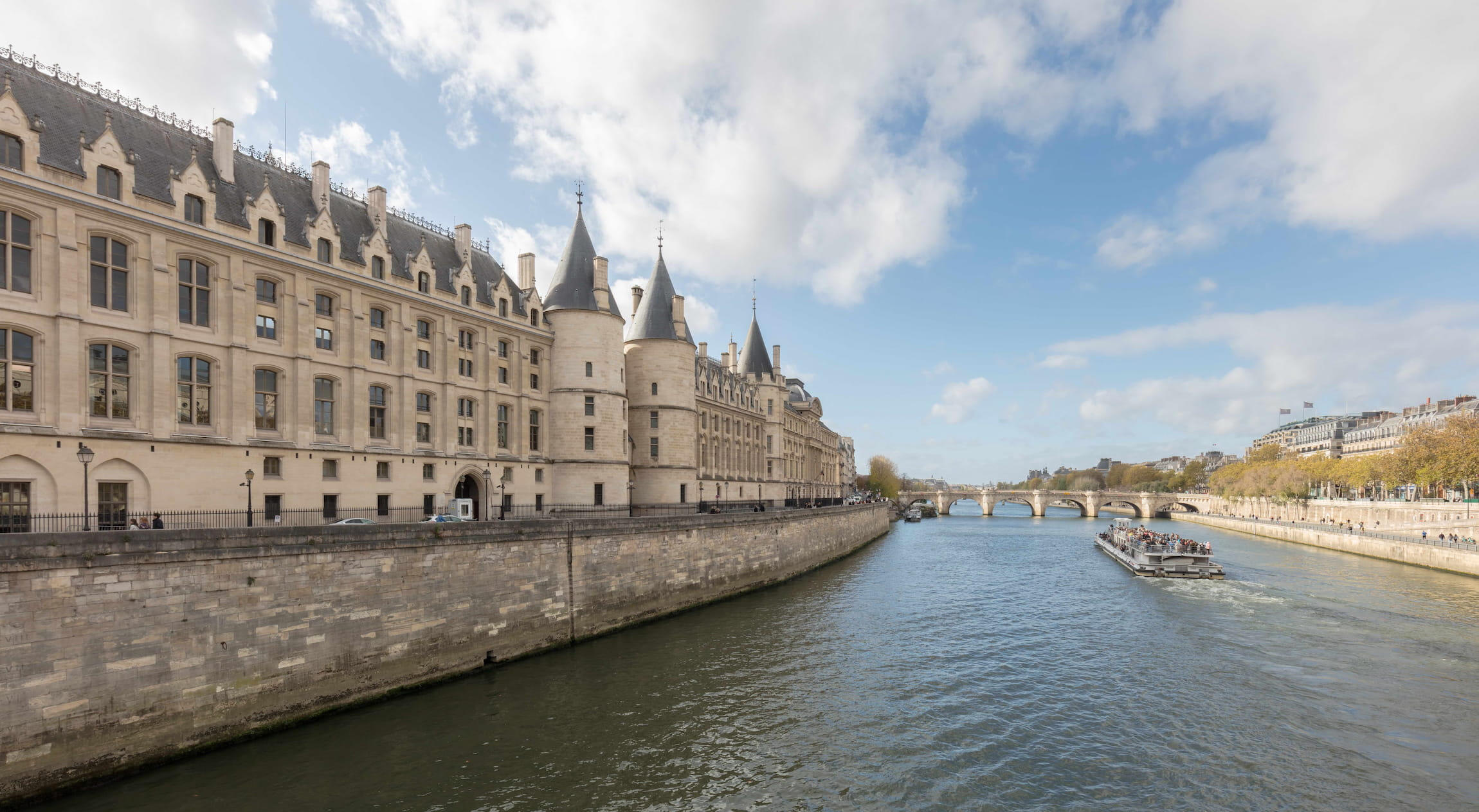 French Legal Services & Administrative Litigation View of the Conciergerie along the Seine River, representing French legal practice.